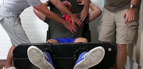  Julian Knowles is restrained and tickled by two kinky studs